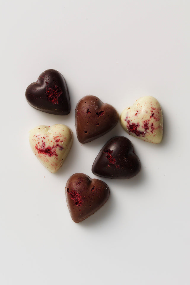 Hearts Raspberry Single Cube Coco Chocolate milk and dark artisan chocolate hearts in cube form with raspberry centres