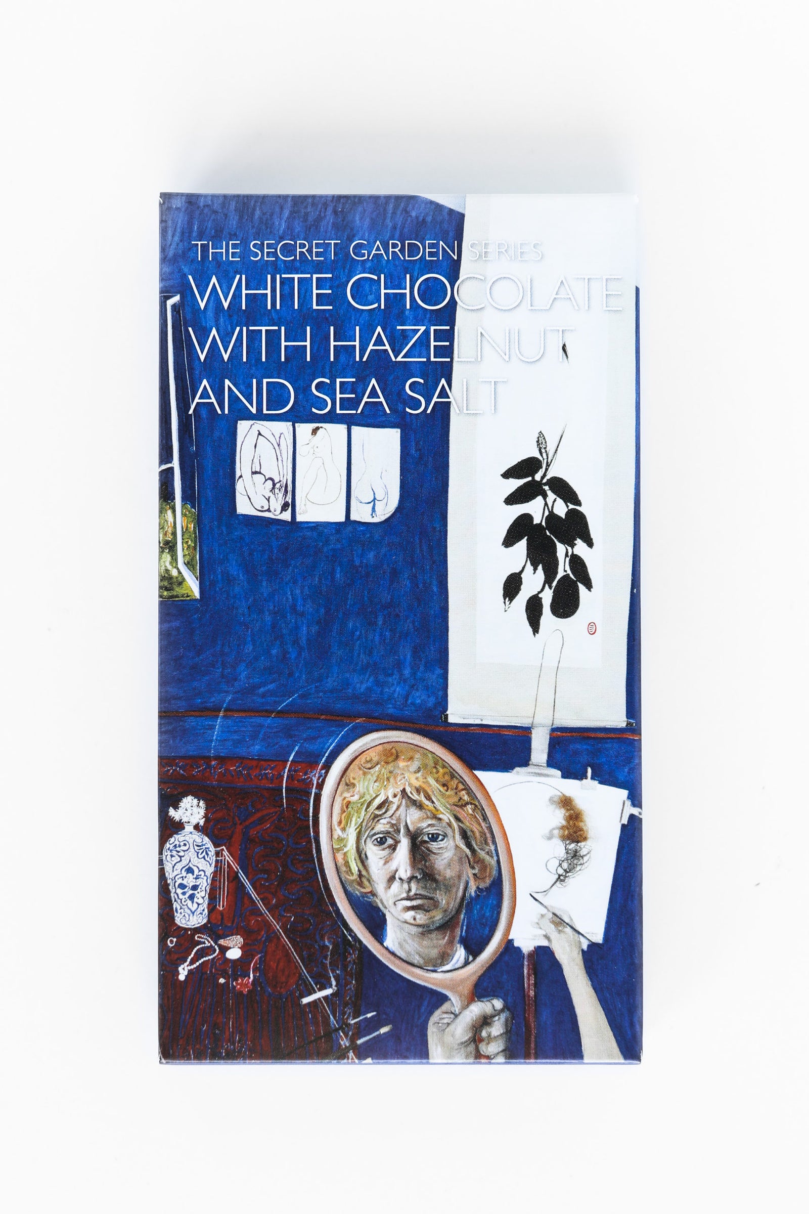 Secret Garden White Hazelnut Seasalt by Coco Chocolate artisan chocolate bar in white and blue packaging